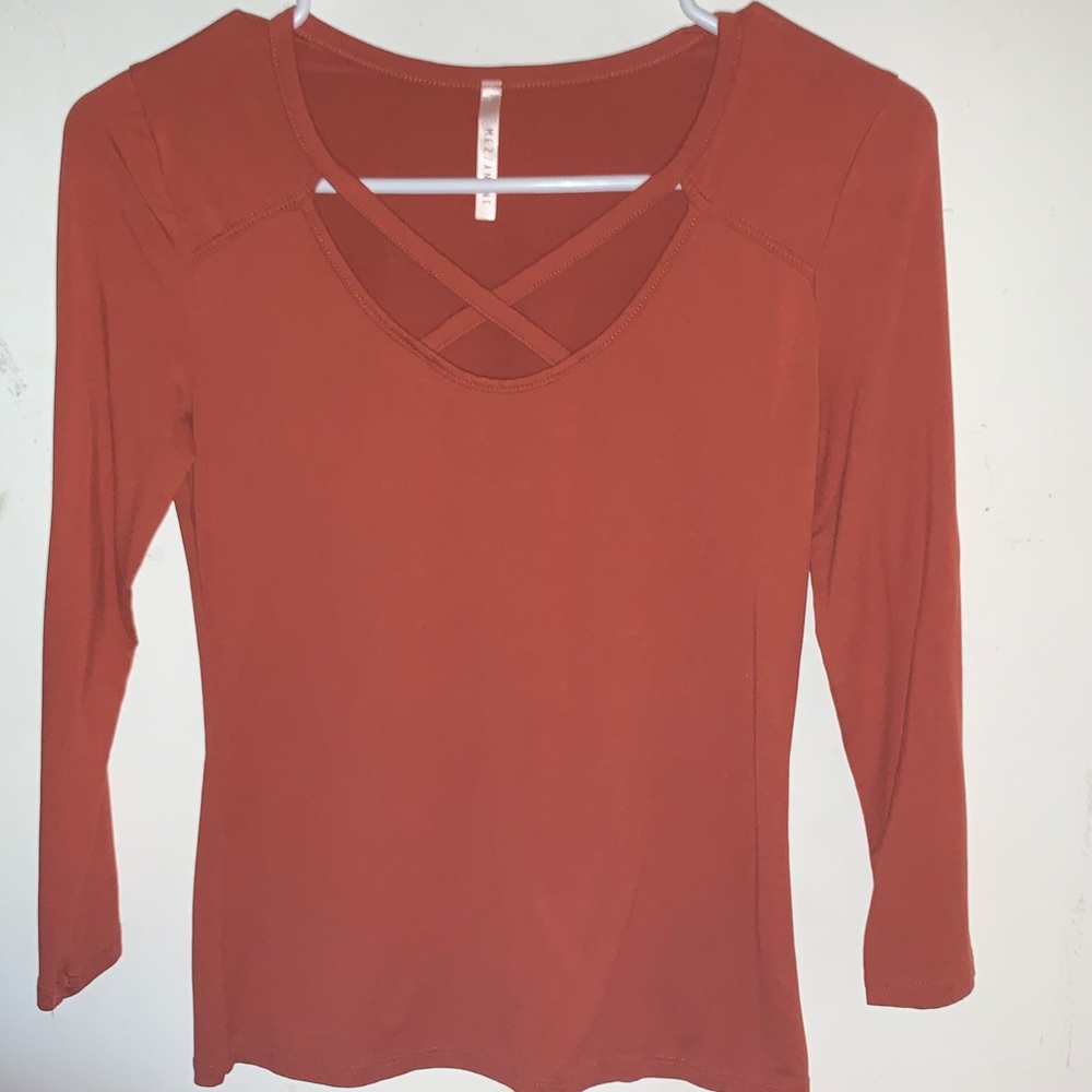 A brown reddish x neck long sleeve